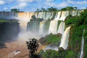 The impressive Iguazu Falls, which separate the Iguazu River into the upper and lower sections, are situated along the border between Argentina and Brazil.