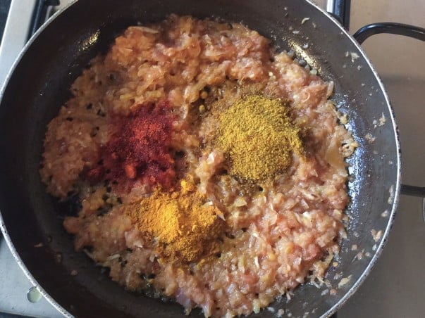 Adding spices to Burmese Shrimp Curry