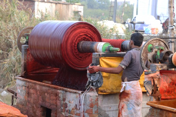 A worker dyeing a Fabric at Sanganer